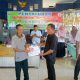 Seorang Keluarga Penerima Manfaat (KPM) menerima Bantuan Langsung Tunai Dana Desa (BLT-DD) tahap I dan II Tahun 2025 yang disalurkan oleh Pemerintah Pekon Pelita Jaya